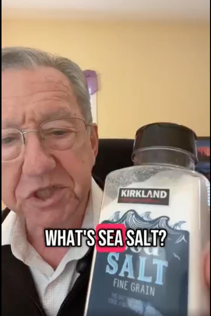 Picture of the speaker holding a bottle of sea salt.